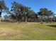 Expansive pasture with mature oak trees at 2403 County Road 416N, Lake Panasoffkee, FL 33538