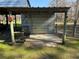 Small metal storage shed with concrete slab at 2403 County Road 416N, Lake Panasoffkee, FL 33538