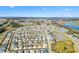 Aerial view of house and community near the lake at 2484 Lynette Ave, The Villages, FL 32163