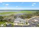 Aerial view of community clubhouse and lakefront at 2484 Lynette Ave, The Villages, FL 32163