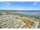 Enjoy stunning views of the neighborhood and surrounding lakes from this beautiful home, indicated by the red star at 2484 Lynette Ave, The Villages, FL 32163