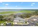 Aerial view of the clubhouse offers breathtaking water views and an inviting atmosphere for social gatherings at 2484 Lynette Ave, The Villages, FL 32163