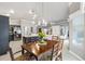 Rustic wooden dining table with six chairs in dining room at 2484 Lynette Ave, The Villages, FL 32163