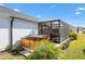 Relaxing hot tub on a patio with lush landscaping at 2484 Lynette Ave, The Villages, FL 32163