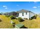 White house exterior with gray roof and landscaped yard at 2484 Lynette Ave, The Villages, FL 32163