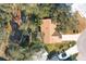 Aerial view showing home, yard, and surrounding neighborhood at 25107 Meriweather Rd, Leesburg, FL 34748