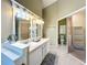 Bright bathroom boasts double sinks, and a large closet at 25107 Meriweather Rd, Leesburg, FL 34748