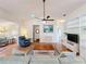 Living room with hardwood floors and built-in shelving at 25107 Meriweather Rd, Leesburg, FL 34748