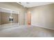 Well-lit bedroom with mirrored closet doors and neutral walls at 25236 River Crest Dr, Leesburg, FL 34748