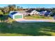 House with driveway and landscaping, viewed from above at 25339 Hibiscus St, Leesburg, FL 34748