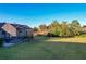 Large backyard with screened patio and open space at 25339 Hibiscus St, Leesburg, FL 34748