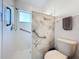 Bathroom with walk-in shower and grab bars at 25339 Hibiscus St, Leesburg, FL 34748