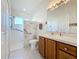 Bathroom with walk-in shower and grab bars at 25339 Hibiscus St, Leesburg, FL 34748