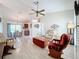 Bright living room with hardwood floors, ceiling fan, and comfortable seating at 25339 Hibiscus St, Leesburg, FL 34748