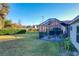 Screened patio and backyard with lush grass at 25339 Hibiscus St, Leesburg, FL 34748