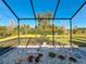 Relaxing screened porch with swing and outdoor seating at 25339 Hibiscus St, Leesburg, FL 34748