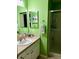 Clean bathroom with lime-green walls and a stand up shower at 2552 Mariel Way, The Villages, FL 32162