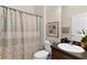 Well-appointed bathroom with shower/tub combo and dark vanity at 2565 Edenville Path, The Villages, FL 32162