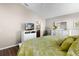 Main bedroom with white dresser and en-suite bathroom at 2565 Edenville Path, The Villages, FL 32162