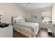 Bright bedroom with double bed, hardwood floors, and window at 2565 Edenville Path, The Villages, FL 32162