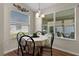 Bright breakfast nook with a round table and four chairs at 2565 Edenville Path, The Villages, FL 32162