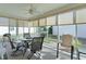 Sunroom with table, chairs, and plenty of natural light at 2565 Edenville Path, The Villages, FL 32162