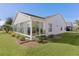 Bright sunroom with windows and sliding glass doors at 2565 Edenville Path, The Villages, FL 32162