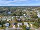 Aerial view of single Gathering home with surrounding landscape at 26154 Newcombe Cir, Leesburg, FL 34748