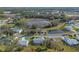 Aerial view of home near lake and community at 26154 Newcombe Cir, Leesburg, FL 34748