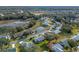 Aerial view of community with lakefront access at 26154 Newcombe Cir, Leesburg, FL 34748