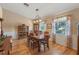 Formal dining room with wood floors, antique furniture, and chandelier at 26154 Newcombe Cir, Leesburg, FL 34748