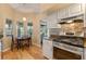 Kitchen nook with breakfast table and view to backyard at 26154 Newcombe Cir, Leesburg, FL 34748