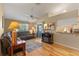 Relaxing living room with hardwood floors and a leather sectional sofa at 26154 Newcombe Cir, Leesburg, FL 34748