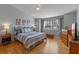 Main bedroom with hardwood floors and ceiling fan at 26154 Newcombe Cir, Leesburg, FL 34748