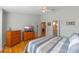 Main bedroom with hardwood floors and large dresser at 26154 Newcombe Cir, Leesburg, FL 34748