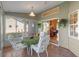 Sunroom with tiled floor, table and chairs, and backyard view at 26154 Newcombe Cir, Leesburg, FL 34748