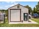 Small utility shed with water meter and large door at 26154 Newcombe Cir, Leesburg, FL 34748