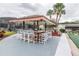 Relaxing poolside bar with seating for residents at 2753 Vindale Rd, Tavares, FL 32778