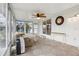 Relaxing sunroom with ceiling fan and views of the backyard at 2753 Vindale Rd, Tavares, FL 32778