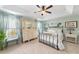 Main bedroom with a metal bed frame and antique dresser at 2775 Sw 158Th St, Ocala, FL 34473