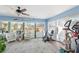 Relaxing sunroom with exercise equipment and backyard access at 2775 Sw 158Th St, Ocala, FL 34473