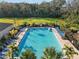 Relaxing community pool and surrounding green space viewed from above at 29567 Caspian St, Leesburg, FL 34748