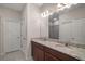 Double vanity bathroom with granite countertop and separate shower at 29567 Caspian St, Leesburg, FL 34748