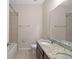 Bathroom with double vanity, granite countertop, and toilet at 29567 Caspian St, Leesburg, FL 34748