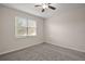 Bright bedroom with large window and neutral carpet at 29567 Caspian St, Leesburg, FL 34748