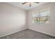 Spacious bedroom with a large window and ceiling fan at 29567 Caspian St, Leesburg, FL 34748