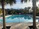 Inviting community pool with lounge chairs, surrounded by palm trees at 29567 Caspian St, Leesburg, FL 34748