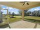 Relaxing screened porch overlooking a lush green backyard at 29567 Caspian St, Leesburg, FL 34748