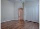 Bedroom with wood floors and double door closet at 3144 Blackstock Way, The Villages, FL 32163