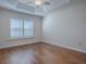 Spacious bedroom with wood floors and shutters at 3144 Blackstock Way, The Villages, FL 32163